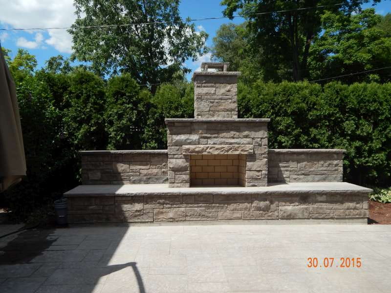 Custom outdoor stone fireplace built by Lakeside Masonry Contracting in Burlington